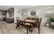 Bright dining room features a rustic wooden table with bench seating at 15047 S 178Th Dr, Goodyear, AZ 85338