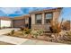 Single-story home with desert landscaping and a two-car garage at 15047 S 178Th Dr, Goodyear, AZ 85338