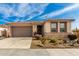 Single-story home with desert landscaping and a two-car garage at 15047 S 178Th Dr, Goodyear, AZ 85338