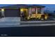 Single-story home with a two-car garage and front landscaping at 15047 S 178Th Dr, Goodyear, AZ 85338