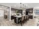 Open concept kitchen with an island and dark cabinetry at 15047 S 178Th Dr, Goodyear, AZ 85338