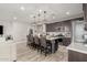 Modern kitchen boasts a large island with seating and stainless steel appliances at 15047 S 178Th Dr, Goodyear, AZ 85338