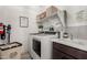 Convenient laundry room with washer, dryer, and extra storage at 15047 S 178Th Dr, Goodyear, AZ 85338