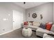 Bright living room with sectional sofa, large windows, and ceiling fan at 15047 S 178Th Dr, Goodyear, AZ 85338