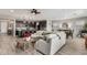 Open living area with a large sectional sofa and tile floors at 15047 S 178Th Dr, Goodyear, AZ 85338
