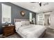 Main bedroom with barn door entry and a view of the bathroom at 15047 S 178Th Dr, Goodyear, AZ 85338