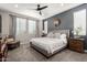 Spacious main bedroom with ceiling fan and large windows at 15047 S 178Th Dr, Goodyear, AZ 85338