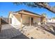 Partial view of backyard with covered patio and mature trees at 15201 N 25Th St, Phoenix, AZ 85032