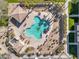 Stunning aerial view of a community pool with lounging areas and lush landscaping at 1578 S Sabino Ct, Gilbert, AZ 85296