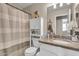 Cozy bathroom with granite countertops, updated vanity, and shower with curtain at 1578 S Sabino Ct, Gilbert, AZ 85296