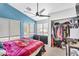 Bright bedroom featuring ample natural light, walk-in closet, and modern ceiling fan at 1578 S Sabino Ct, Gilbert, AZ 85296