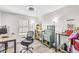 Bright bedroom with hardwood floors, natural light, and an overhead ceiling fan at 1578 S Sabino Ct, Gilbert, AZ 85296