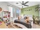 Inviting bedroom features a ceiling fan, wood floors, and ample natural light at 1578 S Sabino Ct, Gilbert, AZ 85296