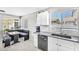 Bright eat-in kitchen area with a breakfast nook, large windows, white cabinets, and granite countertops at 1578 S Sabino Ct, Gilbert, AZ 85296