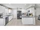 Bright kitchen with white cabinets, granite countertops, and modern appliances, creating a functional space at 1578 S Sabino Ct, Gilbert, AZ 85296