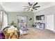 Spacious living room offering natural light, a ceiling fan, and a comfortable seating area at 1578 S Sabino Ct, Gilbert, AZ 85296