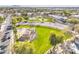 Aerial view of community park featuring green space, play area and walking path in residential neighborhood on a sunny day at 1578 S Sabino Ct, Gilbert, AZ 85296