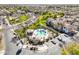Aerial view of community pool area with ample seating, landscaping, and nearby residential homes and gazebo at 1578 S Sabino Ct, Gilbert, AZ 85296