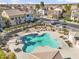 Community pool aerial view featuring lounge chairs and nearby townhomes in residential neighborhood on a sunny day at 1578 S Sabino Ct, Gilbert, AZ 85296