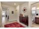 Home entry featuring a view down a hallway, a bathroom and living spaces at 16008 N 109Th Dr, Sun City, AZ 85351