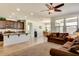 Open kitchen with island and dark brown cabinets at 16008 N 109Th Dr, Sun City, AZ 85351