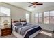 Main bedroom with ceiling fan, large windows, and ample floor space at 16008 N 109Th Dr, Sun City, AZ 85351