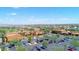 Bird's-eye view of the community showcasing well-maintained landscaping, community buildings, and parking areas at 16954 W Palm Ln, Goodyear, AZ 85395