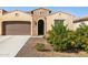 Charming single-story home with a well-manicured front yard and inviting entrance at 16954 W Palm Ln, Goodyear, AZ 85395