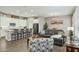 Open-concept living space with modern kitchen, dining area, and a comfortable living room at 16954 W Palm Ln, Goodyear, AZ 85395