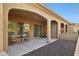 Covered patio with outdoor seating, decorative gravel, and seamless indoor-outdoor flow at 16954 W Palm Ln, Goodyear, AZ 85395