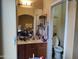 Bathroom with single sink and toilet, adjacent to bedroom at 1718 W Colter St # 170, Phoenix, AZ 85015