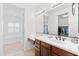 Bright bathroom with granite counters, dual sinks, walk-in closet, and large tub at 17763 N 93Rd Way, Scottsdale, AZ 85255