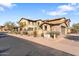 Tan two-story home with tile roof and attached garage at 17763 N 93Rd Way, Scottsdale, AZ 85255