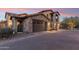 Beautiful two-story home with stone accents and a two-car garage at 17763 N 93Rd Way, Scottsdale, AZ 85255