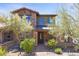 Charming two-story home with stone accents, desert landscaping, and inviting front entrance at 17763 N 93Rd Way, Scottsdale, AZ 85255