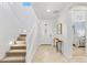 Bright foyer with staircase and a view into the bedroom at 17763 N 93Rd Way, Scottsdale, AZ 85255