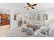 Open concept living room with kitchen and dining area featuring lots of natural light at 17763 N 93Rd Way, Scottsdale, AZ 85255