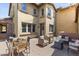 Relaxing outdoor patio with dining table, wicker seating, and string lights at 17763 N 93Rd Way, Scottsdale, AZ 85255