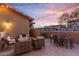 Outdoor patio with string lights, comfortable seating, and dining area at 17763 N 93Rd Way, Scottsdale, AZ 85255