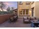 Spacious patio with seating, dining area, and fire pit at 17763 N 93Rd Way, Scottsdale, AZ 85255