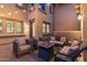 Cozy patio with fire pit, comfortable seating, and string lights at 17763 N 93Rd Way, Scottsdale, AZ 85255