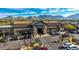 Aerial view of community grocery store featuring ample parking, beautiful mountain views, and convenient access at 17763 N 93Rd Way, Scottsdale, AZ 85255