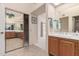 Bright bathroom with double sinks and mirrored closet at 19511 N 143Rd Dr, Sun City West, AZ 85375