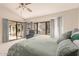 Primary bedroom with patio access and ample natural light at 19511 N 143Rd Dr, Sun City West, AZ 85375