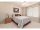 Bedroom with double bed, nightstand, and ceiling fan at 19511 N 143Rd Dr, Sun City West, AZ 85375