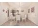 Bright dining room featuring a glass table and window seating at 19511 N 143Rd Dr, Sun City West, AZ 85375