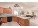 Kitchen features a large island, stainless steel appliances, and ample counter space at 19511 N 143Rd Dr, Sun City West, AZ 85375