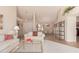 Bright living room with comfy seating and a view to the dining area at 19511 N 143Rd Dr, Sun City West, AZ 85375