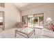 Living room with patio access and a comfy seating arrangement at 19511 N 143Rd Dr, Sun City West, AZ 85375