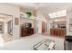 Open concept living room with kitchen and patio access at 19511 N 143Rd Dr, Sun City West, AZ 85375